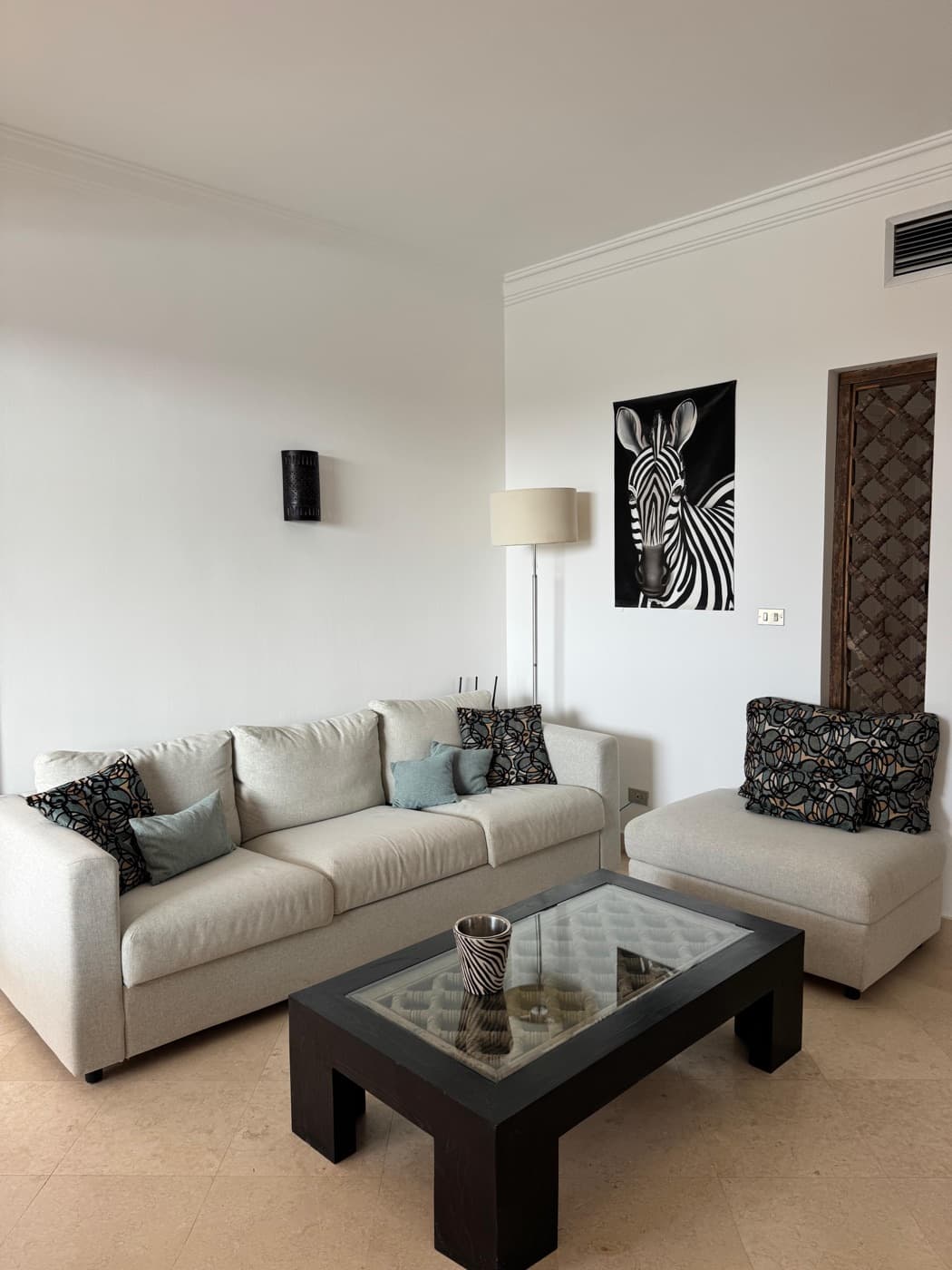 The living room, sofas and terrace doors